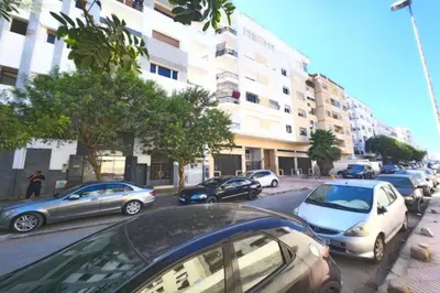 a group of cars parked on a city street at Serenity in Rabat's downtown in Rabat