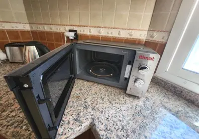 a microwave sitting on a counter in a bathroom at Serenity in Rabat's downtown in Rabat