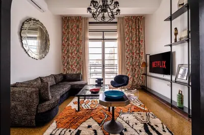 a living room with a couch and a table at Assayag Art Deco - 1930 in Casablanca