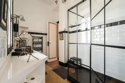 a room with white walls and a glass wall at Assayag Art Deco - 1930 in Casablanca