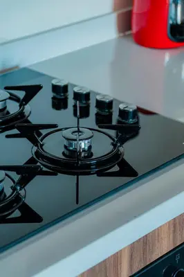 a gas stove top with six burners on it at cozy appartement, convenient local in Casablanca