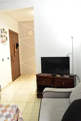 a living room with a flat screen tv on a dresser at Havre de paix appartement in Mohammedia