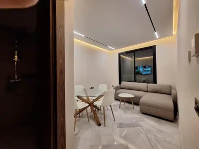 a living room with a couch and a table at Appartement to stay in Casablanca, CfC in Casablanca