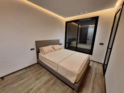 a bedroom with a bed with a large window at Appartement to stay in Casablanca, CfC in Casablanca