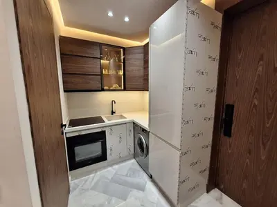 a small kitchen with a washer and dryer at Appartement to stay in Casablanca, CfC in Casablanca