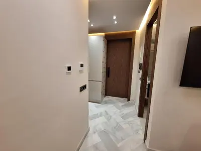 a hallway with a room with a door and a tile floor at Appartement to stay in Casablanca, CfC in Casablanca