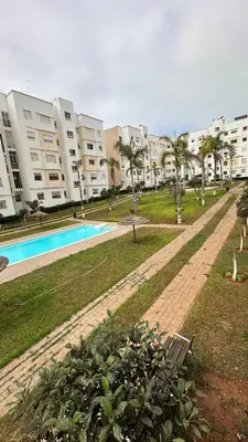 a park with a swimming pool and some buildings at Tamaris in Casablanca
