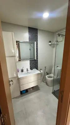 a bathroom with a sink and a toilet and a mirror at Tamaris in Casablanca
