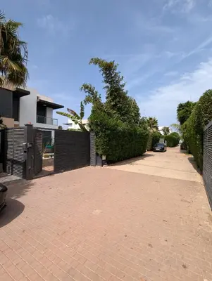a brick driveway with a gate and a fence at Villa 3-bedroom with Private Pool in Tamaris in Tamaris