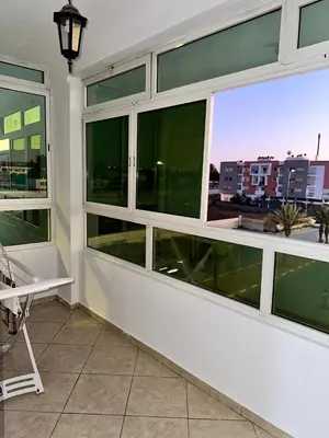a room with large windows with a view of a city at Réservez dès maintenant Calme confort et proximité in Oulad Mbark