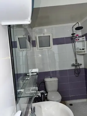 a bathroom with a toilet and a sink at Réservez dès maintenant Calme confort et proximité in Oulad Mbark
