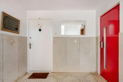 a room with a white door and a red door at Modern 1 Bedroom W Terrace-Arribat Center in Rabat