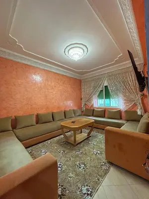 a living room with a couch and a table at Cozy apartment in Skhirat near Rabat in Skhirat