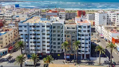 an aerial view of a city with palm trees and the ocean at Solstice 73 Luffy Air Studio in Casablanca