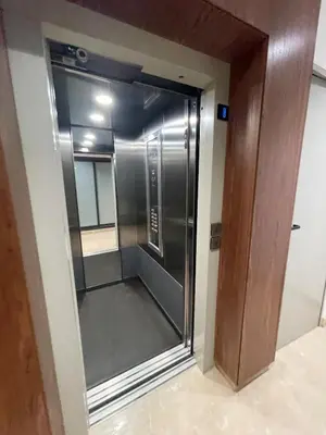 a elevator in a building with a glass door at Solstice 73 Luffy Air Studio in Casablanca