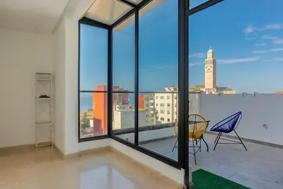 a balcony with a view of a city skyline at Solstice 73 Luffy Air Studio in Casablanca