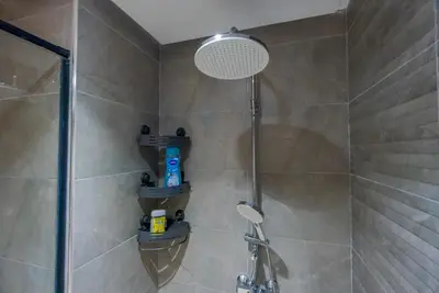 a bathroom with a shower with a shower head at Solstice 73 Luffy Air Studio in Casablanca
