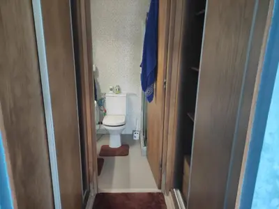 a small bathroom with a toilet in a room at Mansbay Beach Dalia in Mohammedia