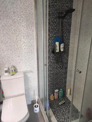 a bathroom with a shower and a toilet in it at Mansbay Beach Dalia in Mohammedia