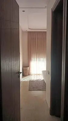 a bathroom with a sink and a window at Casa Comfort Apartment in Casablanca