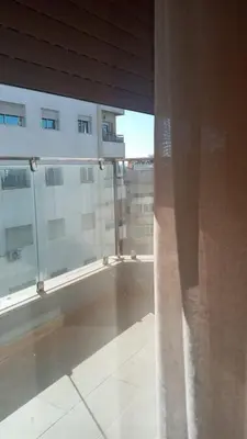 a view of a room with a large window at Casa Comfort Apartment in Casablanca