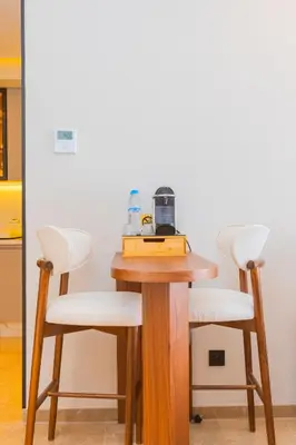 a table with two chairs and a blender on it at Cozy and new apartment in Princesses in Casablanca