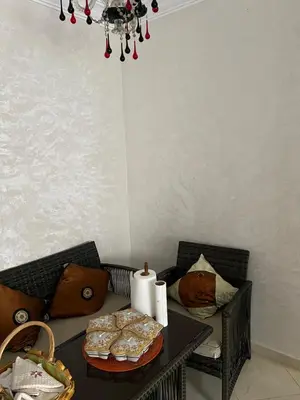 a table with a tray of pastries on top of it at Appartement serein & apaisant in Bouznika