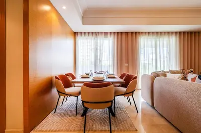 a dining room with a table and chairs at Luxury 3 Bedroom Apartment in the Heart of CFC with Swimming pool in Casablanca