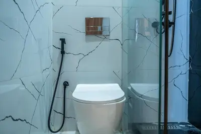 a bathroom with a toilet and a shower at Awesome place with city view maarif casablanca in Maarif
