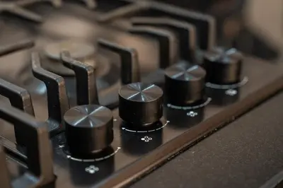a close up of the knobs of a stove at Awesome place with city view maarif casablanca in Maarif