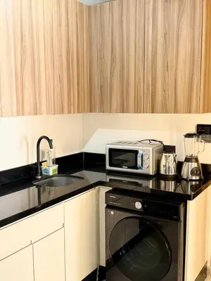 a kitchen with a microwave and a sink at Awesome place with city view maarif casablanca in Maarif