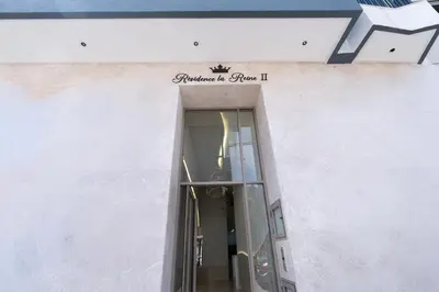 a doorway to a building with a sign on it at Les Princesses - 2BR - Balcony - New Residence - Parking - DAR & STAY in Casablanca