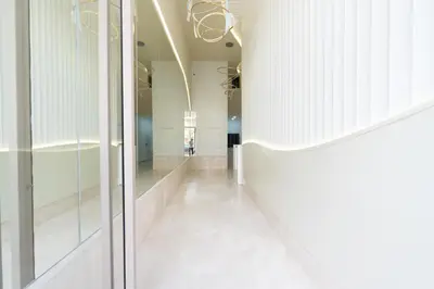 a hallway of a building with white walls and ceilings at Les Princesses - 2BR - Balcony - New Residence - Parking - DAR & STAY in Casablanca