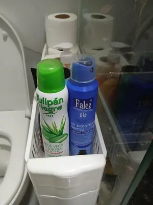 a refrigerator with a bottle of milk and other items at chambre saada in Dar Bouazza