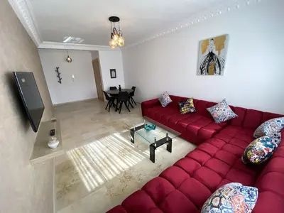 an overhead view of a living room with a red couch at Bourgogne Ocean Prestige in Casablanca