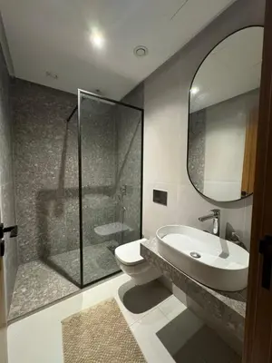 a bathroom with a toilet and a sink and a shower at Luxurious and cozy CFC panoramic view studio in Casablanca