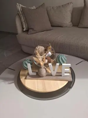a coffee table with a sign that says love at Luxurious and cozy CFC panoramic view studio in Casablanca