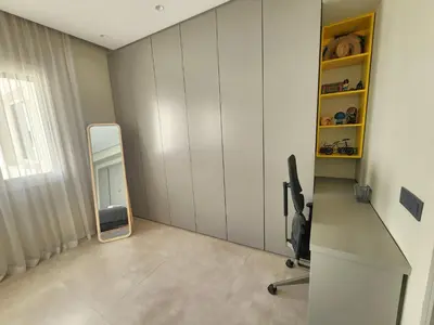 a room with a mirror and a desk and a chair at The 41 Maarif by IB Signature - Boho Chic 1BR Apt - with Wifi - Self check-in - 24 x7 Security - City View with terrace - Walk to Cafes! City Centre in Casablanca