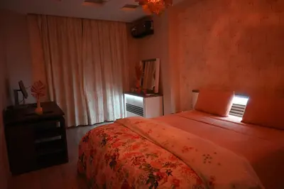 a bedroom with a large bed and a window at Prestigious apartment Elegant and refined in Casablanca