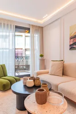 a living room with a couch and a table at Chic Hotel-Style Apartment in Casablanca in Casablanca