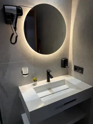 a bathroom with a white sink and a mirror at Studio Le plus Beau Casablanca in Casablanca