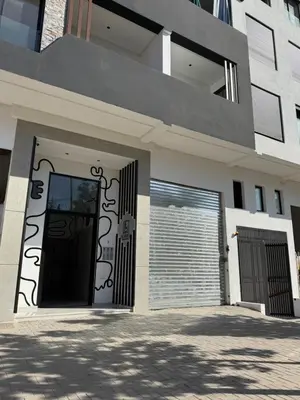 a building with a garage door and a gate at Studio Le plus Beau Casablanca in Casablanca