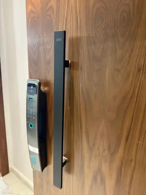 a remote control sticking out of a wooden door at Studio Best in Casablanca in Casablanca