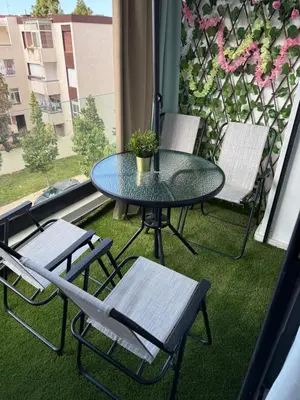 a patio with a table and chairs on a balcony at Studio Le Cœur Casablanca in Casablanca