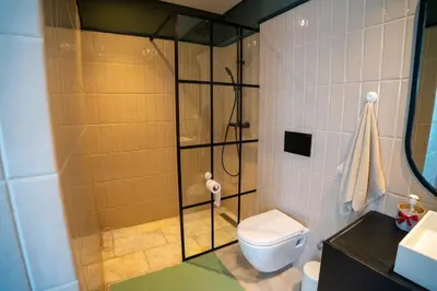a bathroom with a shower and a toilet at Cedar Stays Studio apartment 1chambre salon - WiFi - climatisation - parking - machine a laver- 5 min CFC in Casablanca