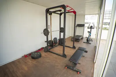 a gym with several tread machines in a room at Cedar Stays Studio apartment 1chambre salon - WiFi - climatisation - parking - machine a laver- 5 min CFC in Casablanca