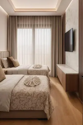 a hotel room with two beds and a television at Margueri House in Mohammedia