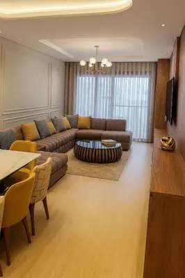 a living room with a couch and a table at Margueri House in Mohammedia
