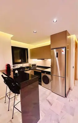 a kitchen with a stainless steel refrigerator and a counter at Modern studio in Casablanca in Casablanca