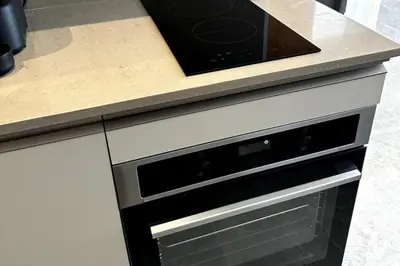 a kitchen with a counter top with a dishwasher at New luxury central apartment in Casablanca